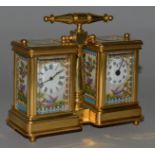 A DOUBLE BRASS CARRIAGE CLOCK AND BAROMETER with Sevres type porcelain panels. 4.5ins high.