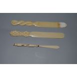 THREE CARVED IVORY LETTER OPENERS.