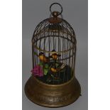 THREE SINGING BIRDS IN A MUSICAL CAGE. 12ins high.