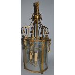 A GOOD 19TH CENTURY CIRCULAR GILT METAL HANGING LANTERN, hung with bell and garlands with ribbons.