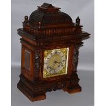 A VICTORIAN CARVED MAHOGANY CASED BRACKET CLOCK with eight day movement, silvered dial, the case