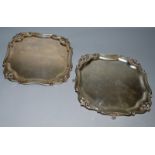 A PAIR OF SCHWARTZ AND STEINER SQUARE SALVERS, with pie crust edges, 10ins square supported on