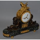 A SUPERB 19TH CENTURY BRONZE AND MARBLE MANTLE CLOCK with white circular dial, 4.5ins diameter,