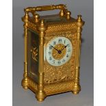 A GOOD 19TH CENTURY FRENCH BRASS FILIGREE CARRIAGE CLOCK with column sides, filigree face.  5ins