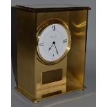 A LARGE TIFFANY & CO BRASS MANTLE CLOCK, 9.25ins high, No. 210780.