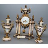 A 19TH CENTURY FRENCH GREY VEINED MARBLE THREE PIECE GARNITURE comprising clock with eight day