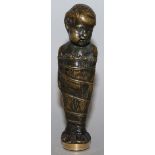 A MATCHING BRONZE DESK SEAL formed as a young child wrapped in a cloth, the seal with a circular