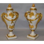 A SUPERB LARGE AND HEAVY PAIR OF LOUIS XVI MARBLE AND ORMOLU TWO HANDLED URN SHAPED VASES AND COVERS