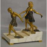 A VERY GOOD ART DECO TWO COLOUR BRONZE AND MARBLE GROUP of three young ladies in bathing dress