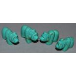 FOUR SMALL CARVED TURQUOISE HIPPOS.