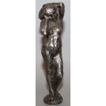 A 1920'S FIGURAL CAST METAL DESK SEAL with circular intaglio to the base, robustly cast as a