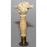 A 19TH CENTURY CARVED IVORY HANDLED SEAL with crosshatch brass circular intaglio with ivory grip