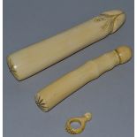 A CARVED IVORY GROUP OF PHALLUSES, 8.5ins and 6.5ins long, along with a ring in a mahogany case with