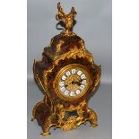 A 19TH CENTURY FRENCH BOULLE MANTLE CLOCK with eight day movement, brass inlay on red tortoiseshell,