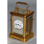 A GOOD BRASS MINIATURE CARRIAGE CLOCK. 2.25ins high.