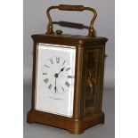 A FRENCH BRASS REPEATER CARRIAGE CLOCK, OVINGTON BROTHERS, NEW YORK.  6ins high.