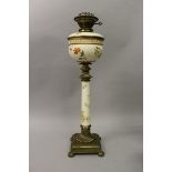 A VICTORIAN WORCESTER PORCELAIN AND BRASS OIL LAMP with porcelain reservoir and supported on a