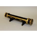 AN ORIENTAL LACQUER SCROLL HOLDER. 12ins long.
