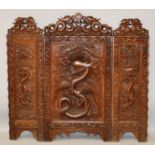 A GOOD CHINESE CARVED TRIPLE FOLDING SCREEN carved with dragons and motifs. 3ft high, 3ft 4ins