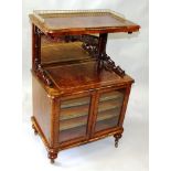 A GOOD VICTORIAN FIGURED WALNUT WHAT-NOT MUSIC CABINET, the top with pierced brass gallery, mirrored