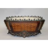A 19TH CENTURY FRENCH INLAID EBONY PLANTER with diamond motifs, gilt mounts and tin liner 17.5ins