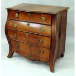 AN 18TH CENTURY DUTCH FLAME MAHOGANY BOMBE FRONTED COMMODE with serpentine shaped front, fitted with