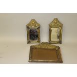 A PAIR OF 18TH CENTURY FRENCH GILT METAL MIRRORS, 11ins x 6ins, and an ormolu MIRROR, 12ins x