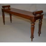 AN EARLY 19TH CENTURY MAHOGANY WINDOW SEAT, the rectangular top with turned hand rails to each