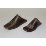 TWO TREEN BOOT MOULDS. 6ins and 5.5ins long.