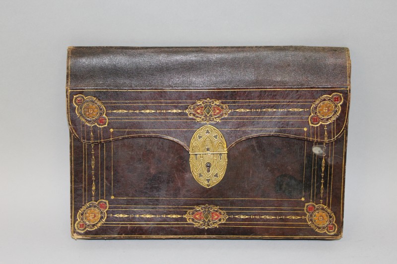 AN EARLY FRENCH LEATHER CASE with folding fitted interior and Paris label.