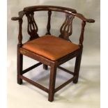 A GEORGIAN WALNUT AND OAK CORNER CHAIR with vase back and drop-in seat.