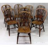 A GOOD HARLEQUIN SET OF EIGHT WINDSOR SINGLE CHAIRS with circular wheel backs, railed supports and