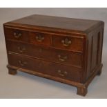 A LOW 18TH CENTURY OAK STRAIGHT FRONT CHEST of three small and two long graduated drawers with brass