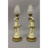 A PAIR OF PAINTED SPELTER CHERUB FIGURAL LAMPS AND SHADES on circular bases 23ins high.