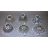 A SET OF SIX VASELINE GLASS SHADES. 6ins wide.