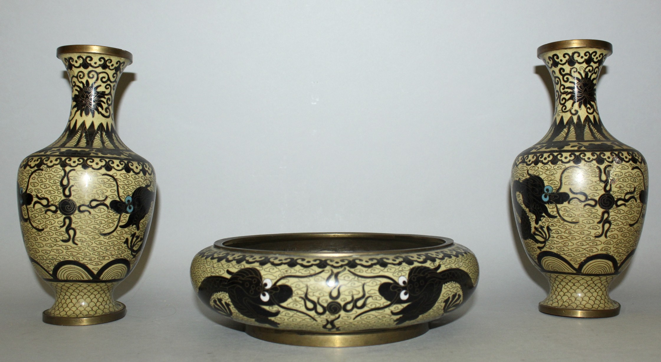 A PAIR OF EARLY 20TH CENTURY CHINESE YELLOW GROUND CLOISONNE VASES & A MATCHING BOWL, each piece