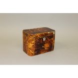 A REGENCY TORTOISESHELL TWO DIVISION TEA CADDY with moulded sides and boxwood frame 6.25ins wide.
