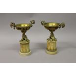 A GOOD PAIR OF LOUIS XVI DESIGN GILT METAL URNS with fruiting vines, supported on marble plinths