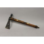 A RARE INDIAN TOMAHAWK WOODEN AND METAL AXE PIPE with diamond cut bone inlay 17ins long.