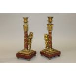 A GOOD PAIR OF 19TH CENTURY LOUIS XVI PATTERN BRONZE CUPID AND RED MARBLE COLUMN CANDLESTICKS on