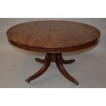 A LATE REGENCY ROSEWOOD CIRCULAR TILT TOP DINING TABLE, 4ft 2ins diameter, supported on centre