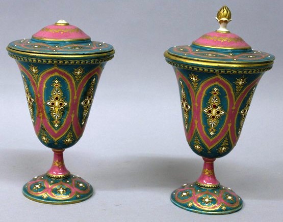 A SUPERB PAIR OF SEVRES PINK URNS AND COVERS with gilt and enamel decoration. Sevres mark in blue
