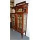 A GOOD LIBERTY & CO MAHOGANY AND INLAID STANDING DISPLAY CABINET (STAMPED LIBERTY & CO).