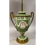 A WEDGWOOD GREEN AND WHITE JASPER URN SHAPED LAMP converted to electricity.