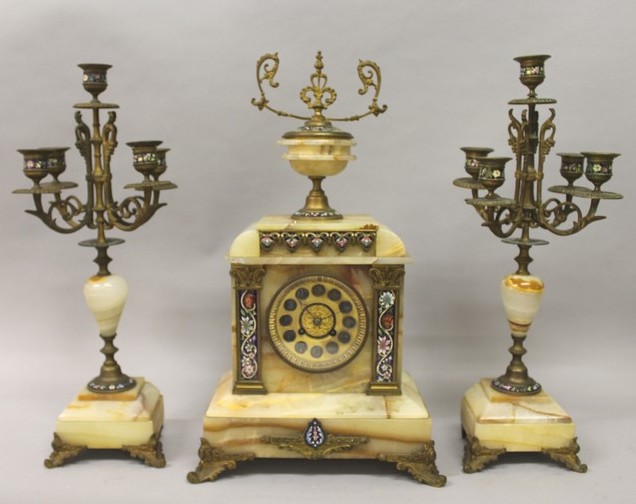 A GOOD 19TH CENTURY FRENCH ONYX AND CHAMPLEVE ENAMEL THREE PIECE CLOCK SET, the clock with eight day