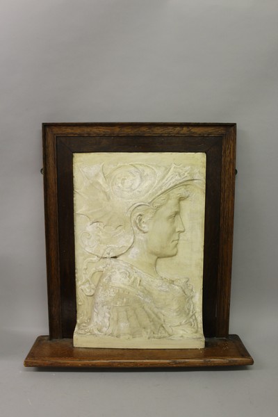 A GRAND TOUR WHITE PLASTER BUST PICTURE OF A YOUNG MAN in a wooden frame 21ins x 14ins.