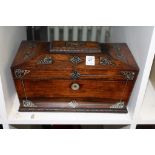 A Victorian rosewood and a mother-of-pearl inlaid sarcophagus shaped tea caddy.