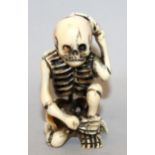 A GOOD SIGNED JAPANESE MEIJI PERIOD IVORY NETSUKE OF A SKELETON BY MATSUYAMA, the skeleton in a