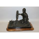 A GOOD QUALITY JAPANESE MEIJI BRONZE SECTIONAL MODEL OF A SPINNER, together with a wood stand, the