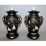 A GOOD PAIR OF FINE QUALITY JAPANESE MEIJI/TAISHO PERIOD WOOD & IVORY VASES & COVERS, the sides of